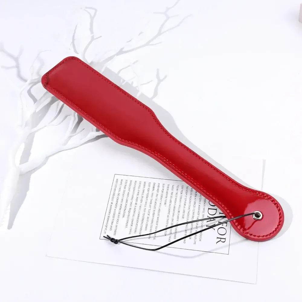 kit bdsm pluma y pala de cuero